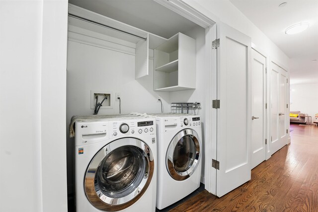 304 Pavonia Ave Unit 202, Jersey City, NJ 07302 - laundry area featuring dark wood finished floors and washer and clothes dryer