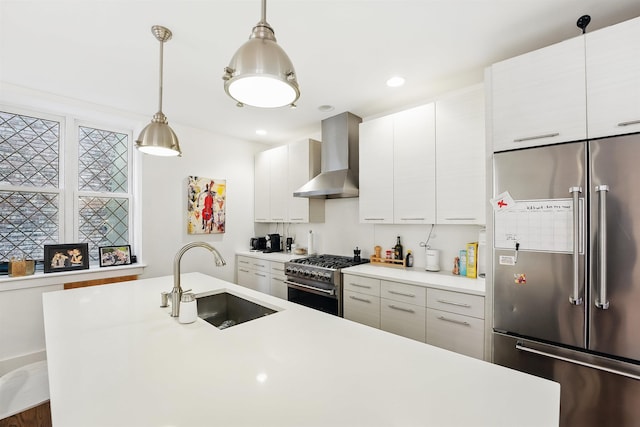 304 Pavonia Ave Unit 202, Jersey City, NJ 07302 - kitchen with high end appliances, wall chimney range hood, light countertops, pendant lighting, and modern cabinets