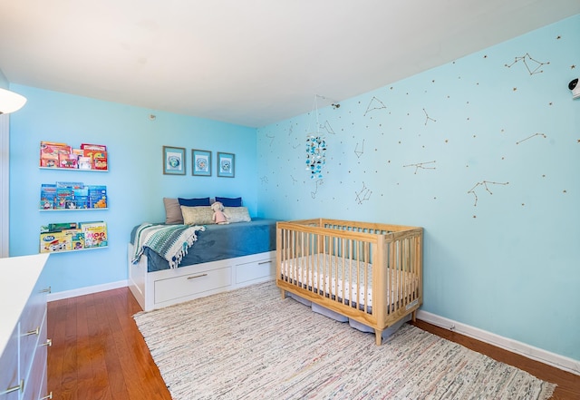 700 Grove St Unit 11P, Jersey City, NJ 07310 - bedroom with wood finished floors and baseboards