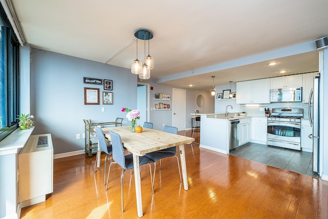 700 Grove St Unit 11P, Jersey City, NJ 07310 - dining space featuring wood finished floors and recessed lighting