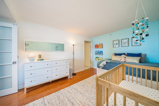 700 Grove St Unit 11P, Jersey City, NJ 07310 - bedroom featuring wood finished floors and baseboards