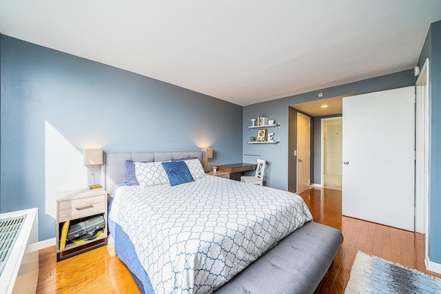 700 Grove St Unit 11P, Jersey City, NJ 07310 - bedroom featuring wood finished floors and recessed lighting