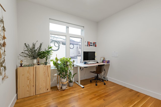 home office with light wood-type flooring