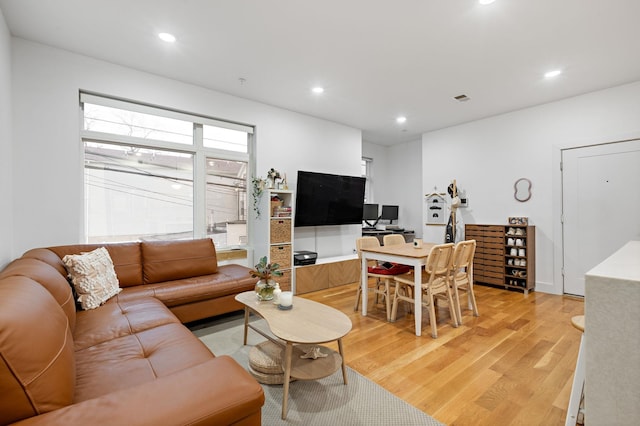 living room with light hardwood / wood-style floors