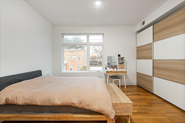 bedroom with light hardwood / wood-style floors