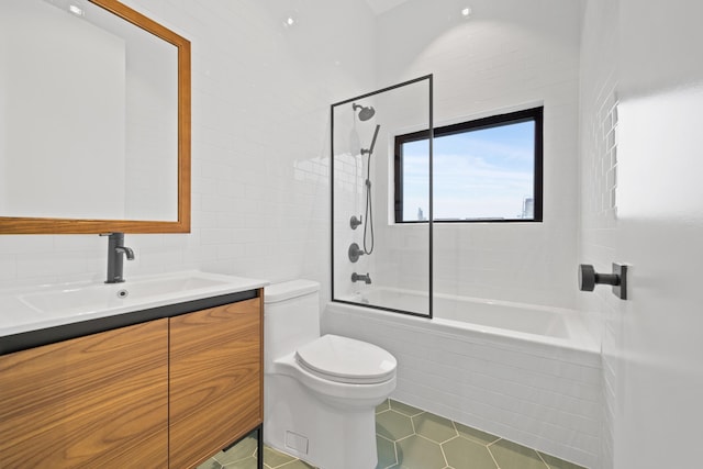 full bathroom with shower / bathtub combination, tile patterned flooring, vanity, and toilet