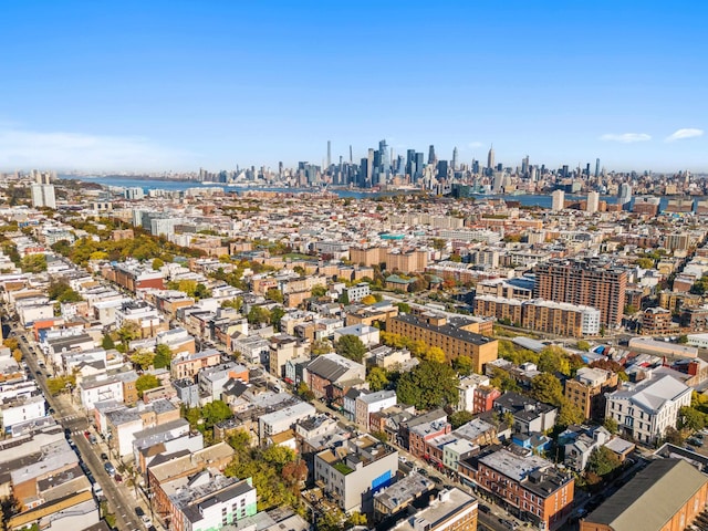 birds eye view of property with a view of city