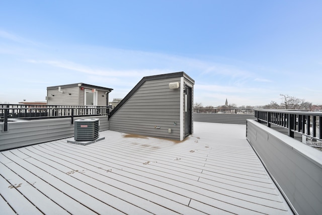 wooden deck featuring central air condition unit