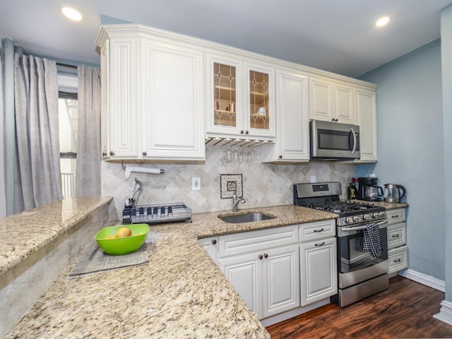 53 Duncan Ave Unit 31, Jersey City, NJ 07304 - kitchen with stainless steel appliances, tasteful backsplash, white cabinets, and recessed lighting
