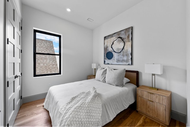 166 New York Ave Unit 2, Jersey City, NJ 07307 - bedroom with light wood-style floors and recessed lighting