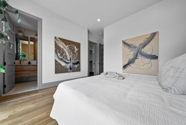 166 New York Ave Unit 2, Jersey City, NJ 07307 - bedroom featuring wood finished floors, recessed lighting, and ensuite bathroom
