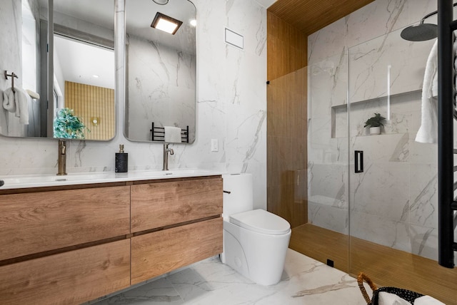 166 New York Ave Unit 2, Jersey City, NJ 07307 - full bathroom featuring marble tiled floors, a marble finish shower, double vanity, and tile walls