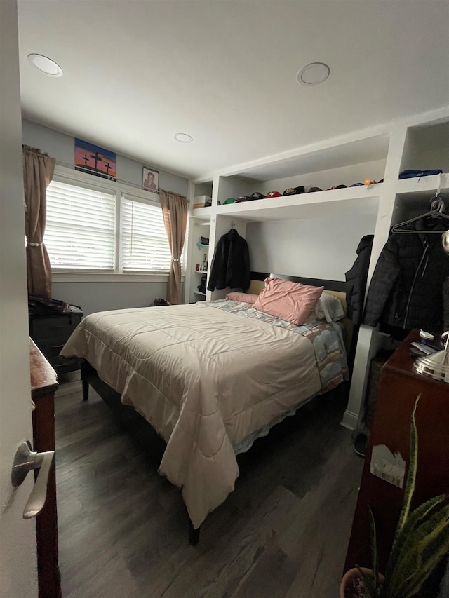 bedroom featuring dark hardwood / wood-style flooring