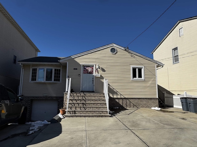 view of front of property with a garage