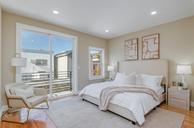 bedroom featuring access to outside, baseboards, light wood finished floors, and recessed lighting