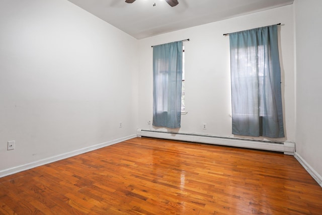315 Pavonia Ave Unit 3, Jersey City, NJ 07302 - unfurnished room featuring a baseboard heating unit, a ceiling fan, and wood finished floors