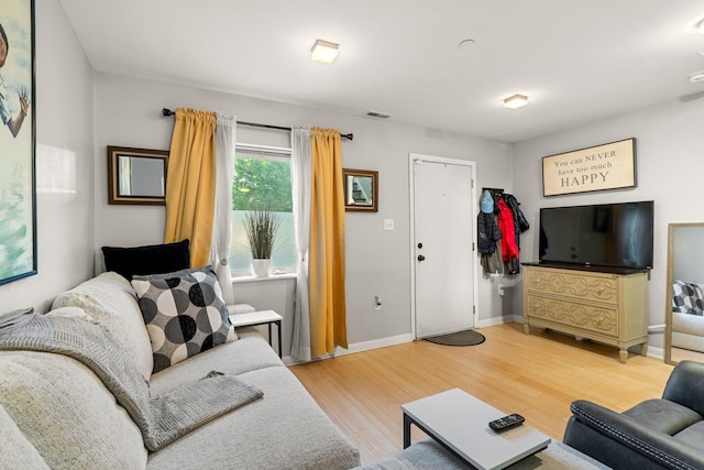 437 Rose Ave, Jersey City, NJ 07305 - living room with light wood finished floors and baseboards