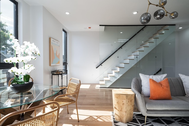 staircase with recessed lighting and wood finished floors