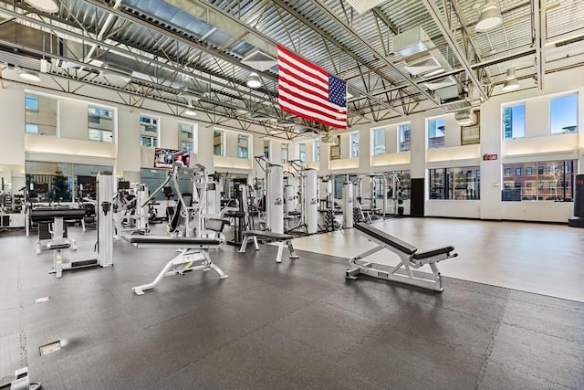 exercise room with a towering ceiling