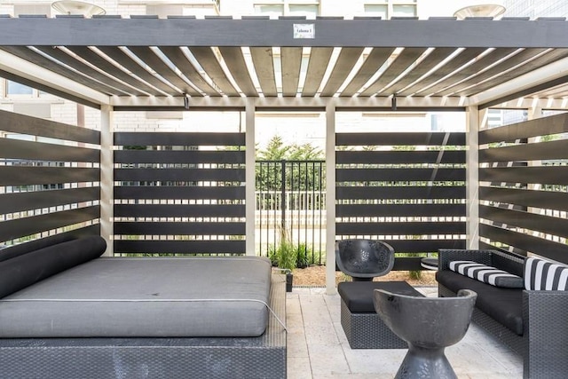 view of patio / terrace with an outdoor living space and a pergola