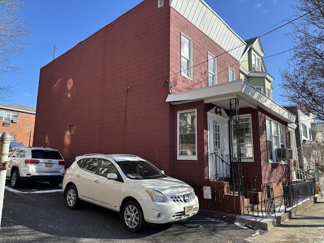 view of side of home with cooling unit