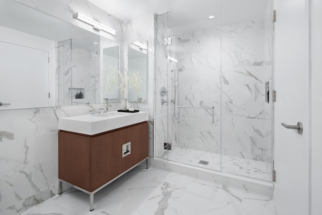 bathroom featuring tile walls, vanity, and an enclosed shower