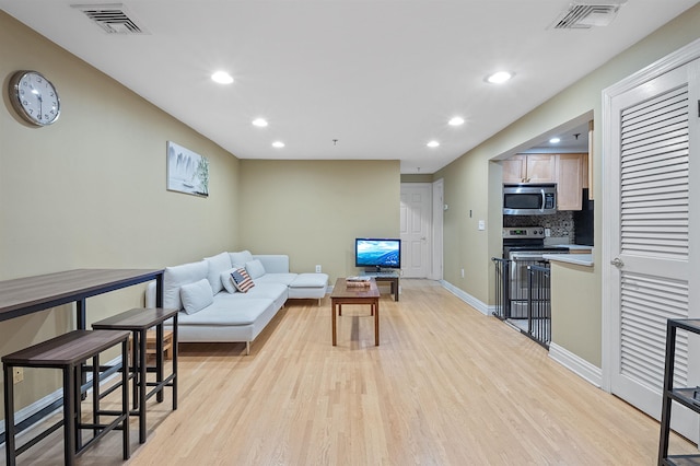 living room featuring light hardwood / wood-style floors