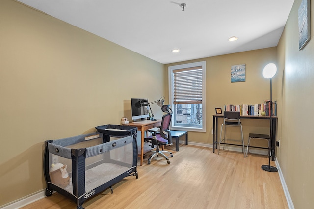 office area with light hardwood / wood-style flooring