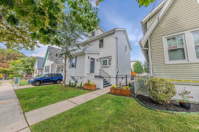 view of front of home with a front lawn