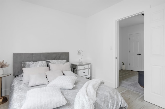 bedroom with light wood-type flooring