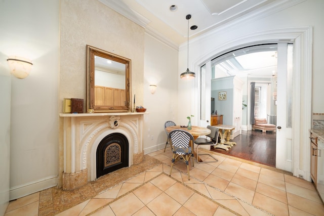 661 Jersey Ave Unit 2, Jersey City, NJ 07302 - living area with crown molding, tile patterned floors, a fireplace, arched walkways, and baseboards