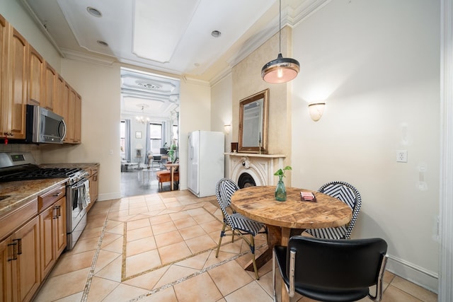 661 Jersey Ave Unit 2, Jersey City, NJ 07302 - kitchen featuring appliances with stainless steel finishes, light tile patterned floors, crown molding, baseboards, and decorative light fixtures