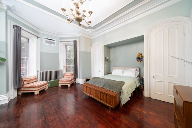 661 Jersey Ave Unit 2, Jersey City, NJ 07302 - bedroom with a chandelier, dark wood-type flooring, an AC wall unit, radiator heating unit, and crown molding