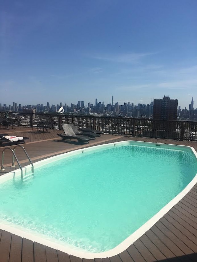 809 22nd St Unit 905, Union City, NJ 07087 - view of swimming pool featuring a view of skyline