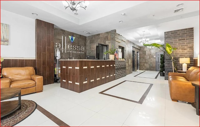 809 22nd St Unit 905, Union City, NJ 07087 - reception featuring a chandelier, tile walls, and recessed lighting