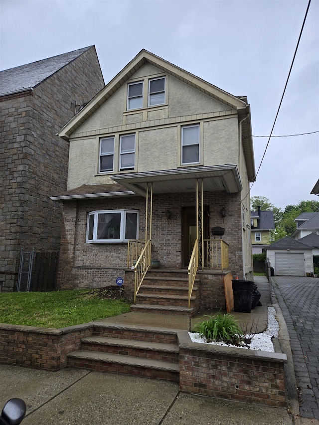 407 77th St, North Bergen, NJ 07047 - view of front of house featuring covered porch, stucco siding, and a garage