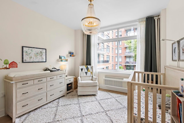 1400 Hudson St Unit 511, Hoboken, NJ 07030 - bedroom featuring a chandelier and a nursery area