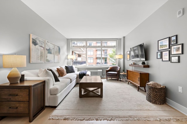 1400 Hudson St Unit 511, Hoboken, NJ 07030 - living room featuring a wall mounted air conditioner and baseboards