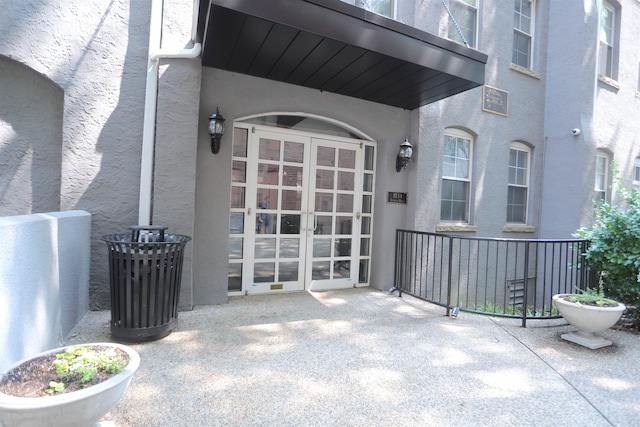 1034 Clinton St Unit 208, Hoboken, NJ 07030 - view of exterior entry featuring french doors and stucco siding