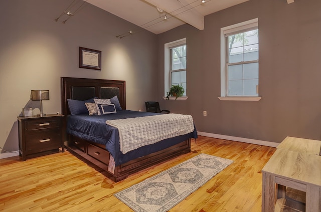 1034 Clinton St Unit 208, Hoboken, NJ 07030 - bedroom with rail lighting and light wood-style floors