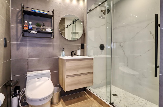 1034 Clinton St Unit 208, Hoboken, NJ 07030 - bathroom featuring tile walls, a marble finish shower, and vanity