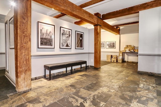 1034 Clinton St Unit 208, Hoboken, NJ 07030 - corridor with stone tile flooring, decorative columns, and beamed ceiling