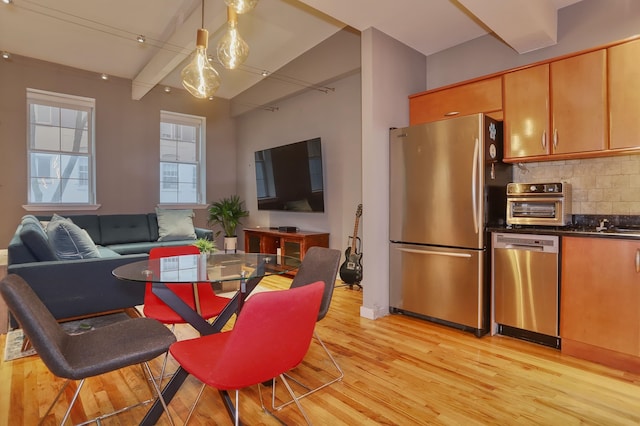 1034 Clinton St Unit 208, Hoboken, NJ 07030 - dining space featuring light wood-style flooring and beamed ceiling