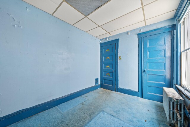 152 Bidwell Ave, Jersey City, NJ 07305 - carpeted spare room featuring radiator heating unit and a paneled ceiling