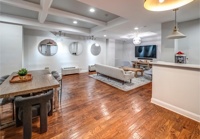 living area featuring recessed lighting, beam ceiling, coffered ceiling, hardwood / wood-style flooring, and baseboards