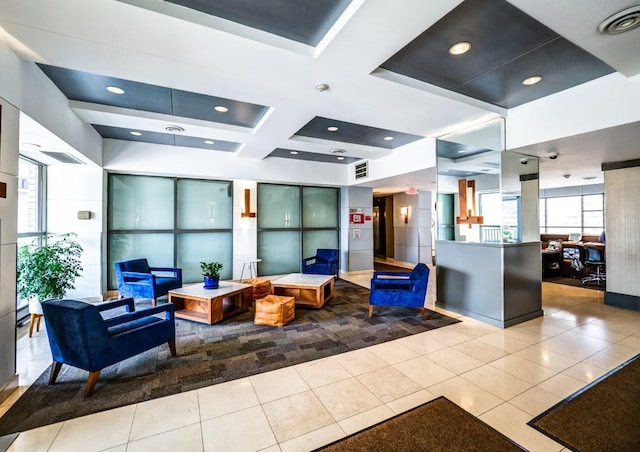community lobby featuring coffered ceiling, beamed ceiling, and recessed lighting