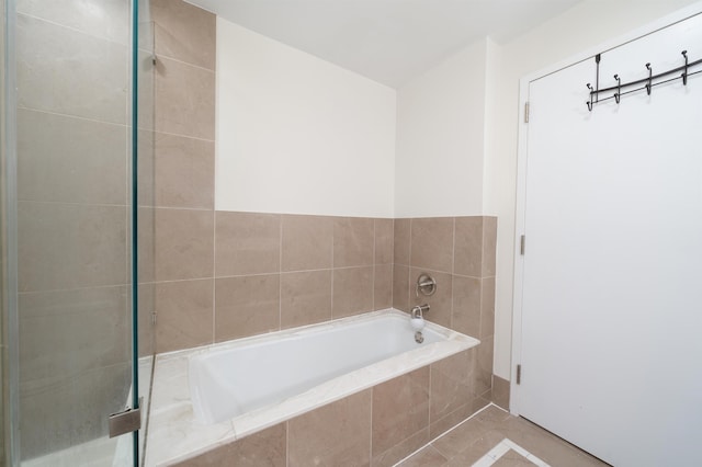 bathroom with tiled bath