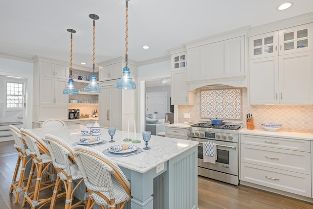 26 Bridge St, Bay Head Borough, NJ 08742 - kitchen with high end stove, tasteful backsplash, white cabinetry, a center island, and ornamental molding