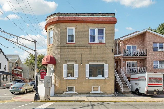 view of front of home featuring brick siding