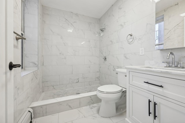 bathroom with marble finish floor, a baseboard radiator, toilet, a tile shower, and vanity